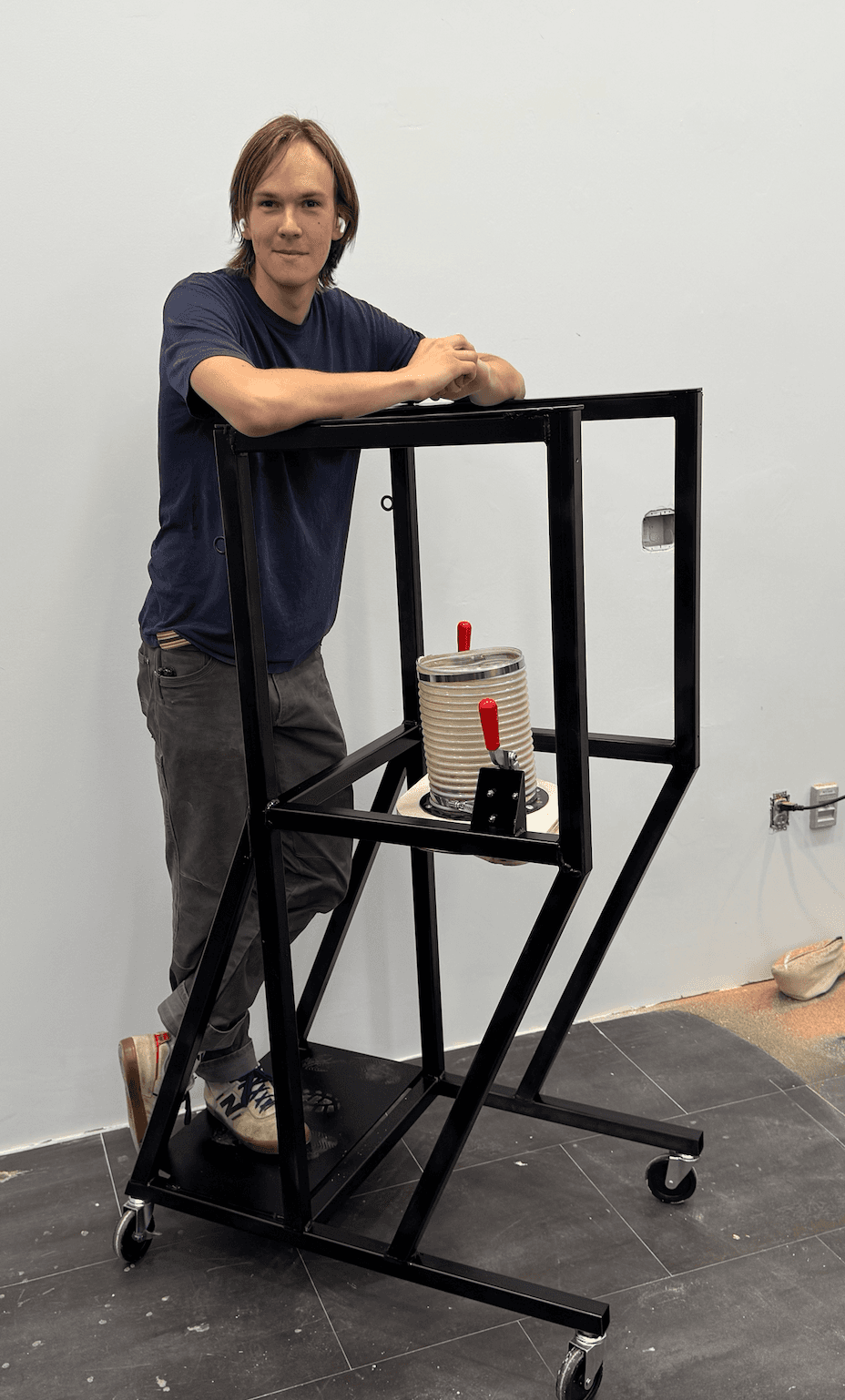 Welded dust collector frame staged in the machine shop